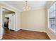 Dining room featuring views of the kitchen and a large window at 1039 Megan Ct, Sugar Hill, GA 30518