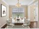 Bright dining room with glass table and seating for eight at 1039 Megan Ct, Sugar Hill, GA 30518