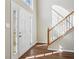 Bright foyer with hardwood floors and a staircase leading to the second floor at 1039 Megan Ct, Sugar Hill, GA 30518