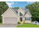 Charming traditional home with a two-car garage and well-manicured lawn at 1039 Megan Ct, Sugar Hill, GA 30518