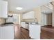 Open kitchen with stainless steel appliances, including dishwasher, and modern wood floors at 1039 Megan Ct, Sugar Hill, GA 30518