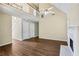Large, open-concept living room with hardwood floors, fireplace and upper level view at 1039 Megan Ct, Sugar Hill, GA 30518