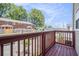View from a wood floored balcony with a wood railing overlooking the neighborhood at 277 Ralph David Abernathy Sw Blvd, Atlanta, GA 30312