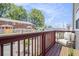 Balcony featuring wood flooring, a chair and table with an outdoor view of the surrounding area at 277 Ralph David Abernathy Sw Blvd, Atlanta, GA 30312