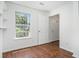 Bright bedroom with hardwood floors, a window, a closet, and white walls at 277 Ralph David Abernathy Sw Blvd, Atlanta, GA 30312
