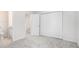 Light bedroom with carpet, closet, and bathroom at 277 Ralph David Abernathy Sw Blvd, Atlanta, GA 30312