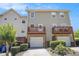 Rear exterior of a townhome with two balconies and two garage spaces at 277 Ralph David Abernathy Sw Blvd, Atlanta, GA 30312