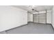 Spacious garage with a sectional garage door, white walls, and ample room for storage at 277 Ralph David Abernathy Sw Blvd, Atlanta, GA 30312