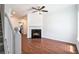 Bright living room features wood floors and fireplace with ceiling fan at 277 Ralph David Abernathy Sw Blvd, Atlanta, GA 30312