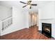 Open-concept living room features hardwood floors and a cozy fireplace at 277 Ralph David Abernathy Sw Blvd, Atlanta, GA 30312