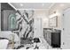 Beautiful bathroom showcasing a walk-in shower with decorative marble accents, vanity, and decorative stain glass window at 4670 Hamden Forest Sw Dr, Atlanta, GA 30331
