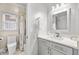 Bathroom featuring gray cabinets with a white countertop and a shower at 4670 Hamden Forest Sw Dr, Atlanta, GA 30331