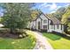 Elegant two-story home with a well-manicured lawn and circular driveway at 4670 Hamden Forest Sw Dr, Atlanta, GA 30331