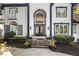 Elegant home facade featuring a grand entrance, stone steps, and lush landscaping for an inviting curb appeal at 4670 Hamden Forest Sw Dr, Atlanta, GA 30331