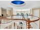 Open foyer showcases a staircase with wood railing, high ceilings with a dome, and arched windows overlooking living spaces at 4670 Hamden Forest Sw Dr, Atlanta, GA 30331