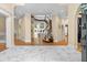 Grand foyer featuring marble floors and a curved staircase at 4670 Hamden Forest Sw Dr, Atlanta, GA 30331