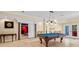 Finished basement area with a pool table in the center of the room at 4670 Hamden Forest Sw Dr, Atlanta, GA 30331