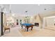Finished basement area with a pool table in the center of the room and a fireplace at 4670 Hamden Forest Sw Dr, Atlanta, GA 30331