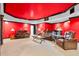 Finished basement area with red walls and ceiling and a large projector screen at 4670 Hamden Forest Sw Dr, Atlanta, GA 30331