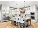 Bright kitchen with white cabinets, stainless steel appliances and a large center island with seating at 4670 Hamden Forest Sw Dr, Atlanta, GA 30331