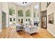 Bright living room with a fireplace and lots of windows at 4670 Hamden Forest Sw Dr, Atlanta, GA 30331