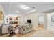 Open-concept living area with cozy floral sofas and ample natural light at 4670 Hamden Forest Sw Dr, Atlanta, GA 30331