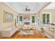 Sun-filled living room with hardwood floors, fireplace, and large windows overlooking the landscaped yard at 4670 Hamden Forest Sw Dr, Atlanta, GA 30331