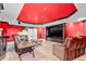 Entertainment room featuring a large television and comfortable leather seating at 4670 Hamden Forest Sw Dr, Atlanta, GA 30331