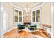 Sitting room with hardwood floors, a fireplace, and large windows offering bright, natural lighting at 4670 Hamden Forest Sw Dr, Atlanta, GA 30331