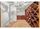 Spacious wine cellar with wooden racks, cabinet and decorative lighting at 4670 Hamden Forest Sw Dr, Atlanta, GA 30331