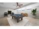 Finished basement game room showcases a pool table, ceiling fan, and recessed lighting at 5610 N Allen Rd, Mableton, GA 30126