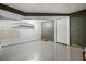 Unfinished basement storage room featuring concrete block walls, and door at 5610 N Allen Rd, Mableton, GA 30126