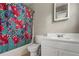 Bathroom showcases a tub with a colorful curtain and a white vanity at 5610 N Allen Rd, Mableton, GA 30126