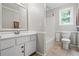 Bathroom features a single sink vanity, white trim, and a tub/shower combo at 5610 N Allen Rd, Mableton, GA 30126