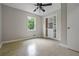 Cozy bedroom featuring a ceiling fan, built-in closet, and natural light at 5610 N Allen Rd, Mableton, GA 30126