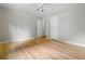 Spacious bedroom with hardwood floors, neutral walls, and bright lighting at 5610 N Allen Rd, Mableton, GA 30126