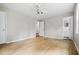 Neutral bedroom features hardwood floors and ensuite access to a full bath at 5610 N Allen Rd, Mableton, GA 30126