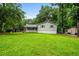 Charming single-Gathering home with a well-manicured lawn and mature trees at 5610 N Allen Rd, Mableton, GA 30126
