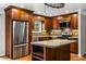 Modern kitchen featuring stainless steel appliances, island, and ample counter space at 5610 N Allen Rd, Mableton, GA 30126
