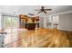 Spacious living area with hardwood floors, stairs, kitchen, and sliding doors at 5610 N Allen Rd, Mableton, GA 30126