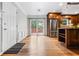 Living area with hardwood floors, stainless steel appliances, and access to deck at 5610 N Allen Rd, Mableton, GA 30126