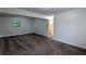 Large basement area with a glimpse into the bathroom, showcasing the layout's possibilities at 2168 Sara Ashley Way, Lithonia, GA 30058