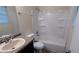 Bright bathroom featuring a tub-shower combo with white tiling and a modern vanity at 2168 Sara Ashley Way, Lithonia, GA 30058