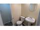 Half bathroom featuring a toilet and sink, great for added convenience at 2168 Sara Ashley Way, Lithonia, GA 30058