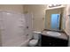 Clean bathroom featuring shower-tub combination, a large mirror, and modern vanity at 2168 Sara Ashley Way, Lithonia, GA 30058
