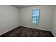 Compact bedroom with carpeted floors and a window providing natural light at 2168 Sara Ashley Way, Lithonia, GA 30058
