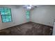 Spacious bedroom with neutral walls, carpet flooring, and two windows providing natural light at 2168 Sara Ashley Way, Lithonia, GA 30058