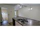 Spacious kitchen with stainless steel sink, granite countertops, vaulted ceiling and access to the living area at 2168 Sara Ashley Way, Lithonia, GA 30058