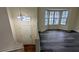 Bright living room with hardwood floors, large windows, and natural light from the entrance foyer at 2168 Sara Ashley Way, Lithonia, GA 30058
