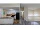 Open-concept living area with hardwood floors connected to a kitchen, and lots of natural light at 2168 Sara Ashley Way, Lithonia, GA 30058